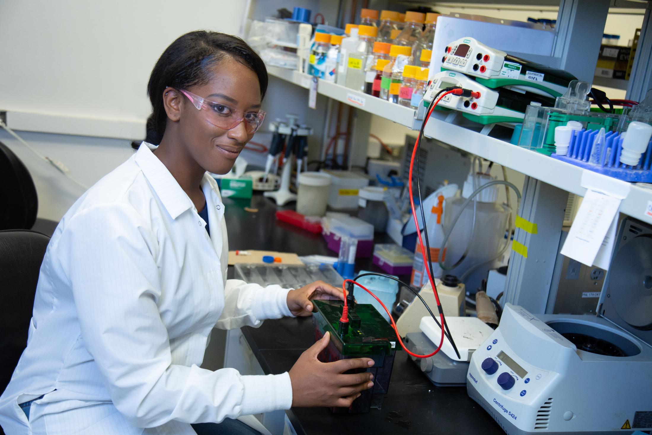 Tayler Smith sits in the lab. David Slipher/UC Davis