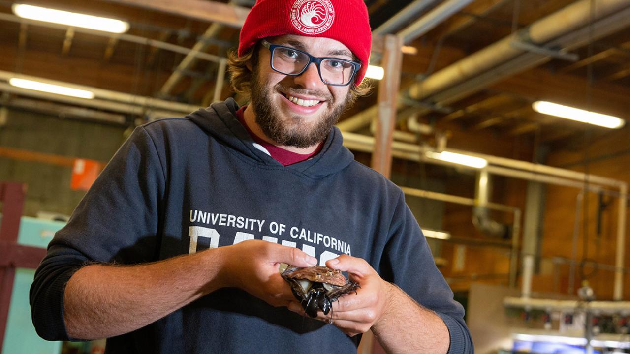 Student holding abalone