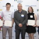 A group shot of the top graduate award recipients with the CBS dean